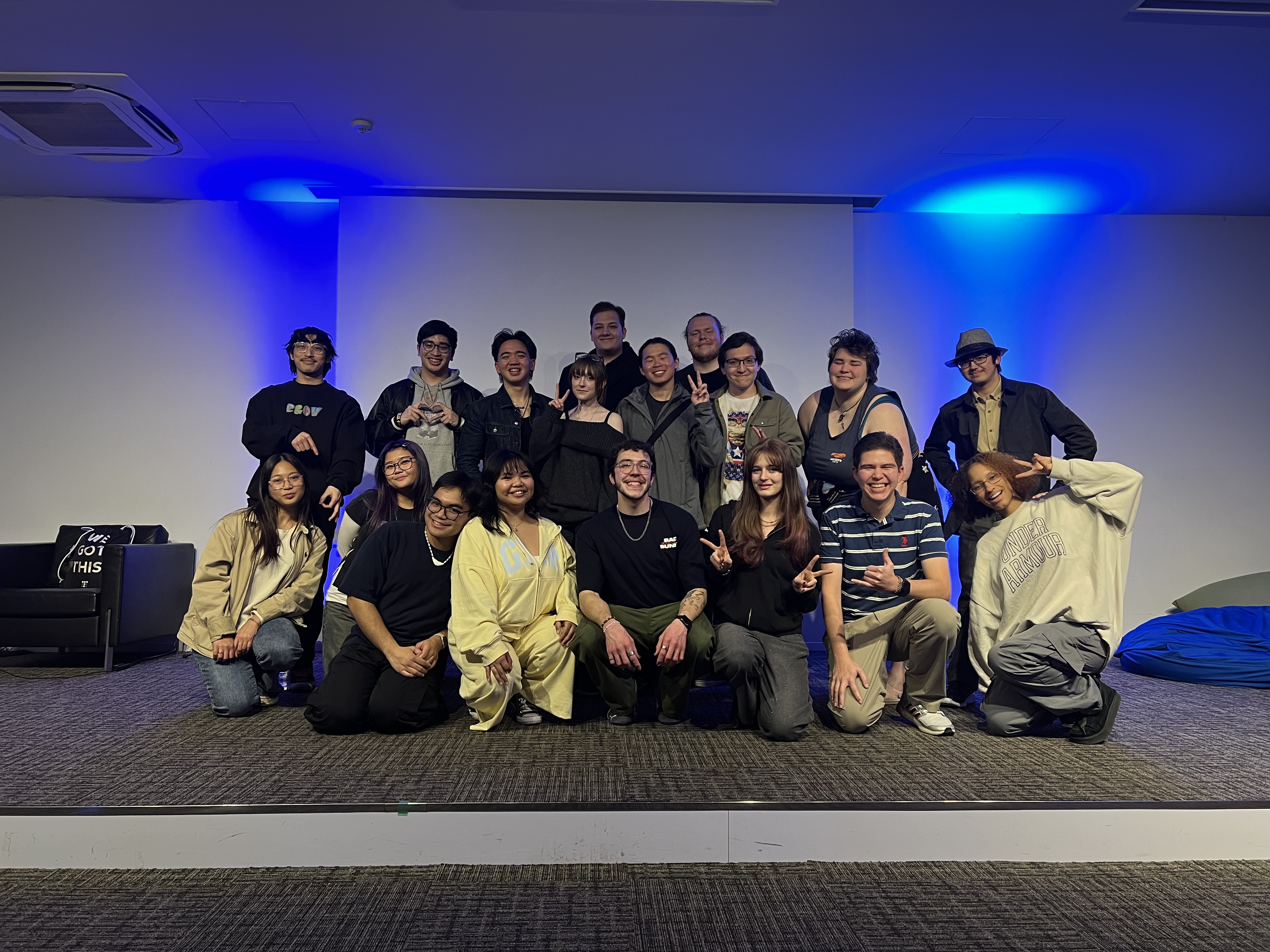 A picture of Programme Board members and participants standing on stage.