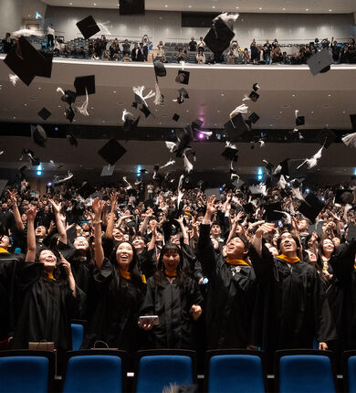 Class of 2025 tossing caps