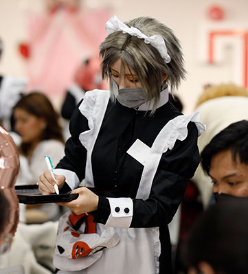 TUJ students in maid outfits take orders at a maid cafe held at TUJ.