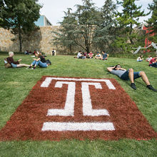 Students relaxing in the Main Campus lawn area.