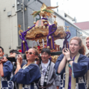 Students carrying a shrine (mikoshi) for the Kifune Shrine Festival