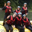 Students smiling on a raft in the Nagatoro River