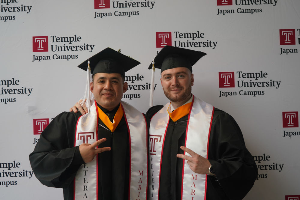 Graduates in front of the Hitomi Hall