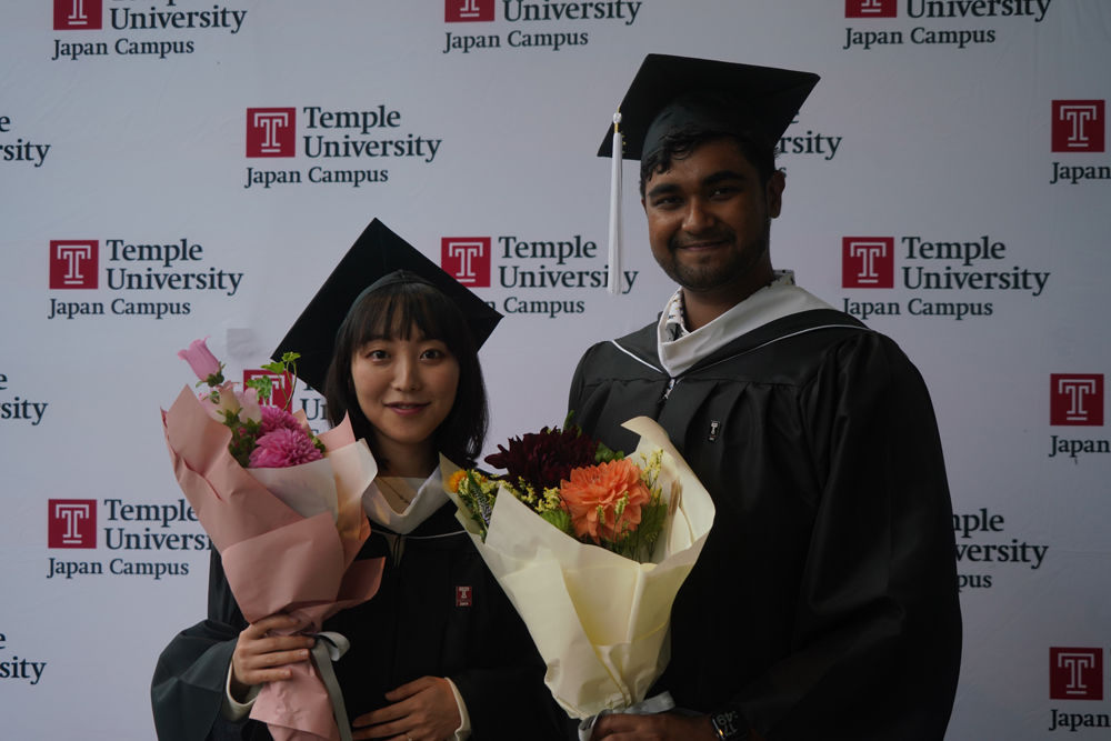 Graduates in front of the Hitomi Hall