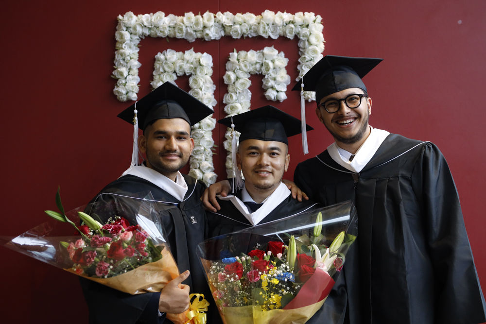 Graduates in front of the Hitomi Hall