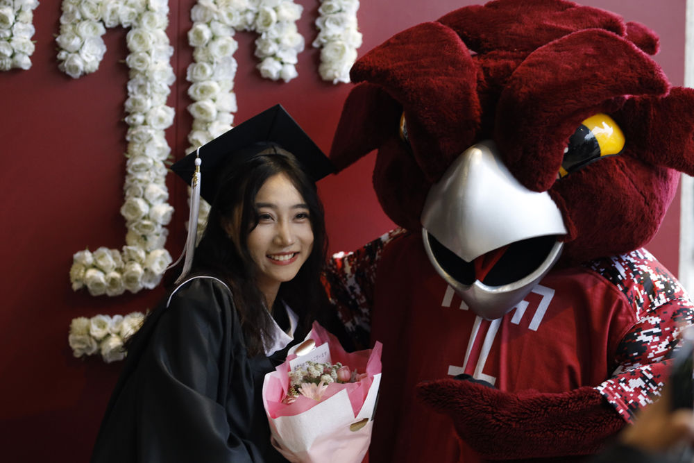 A graduate with Hooter