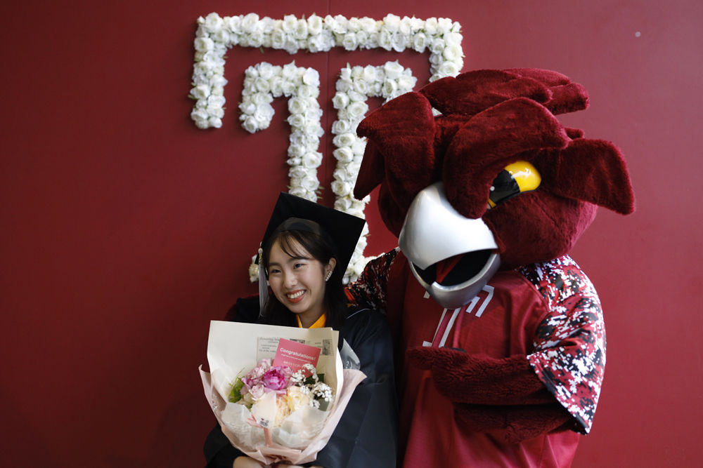 A graduate with Hooter