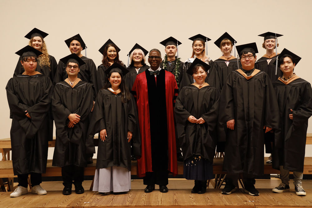Master in Management Graduates and the Program Director