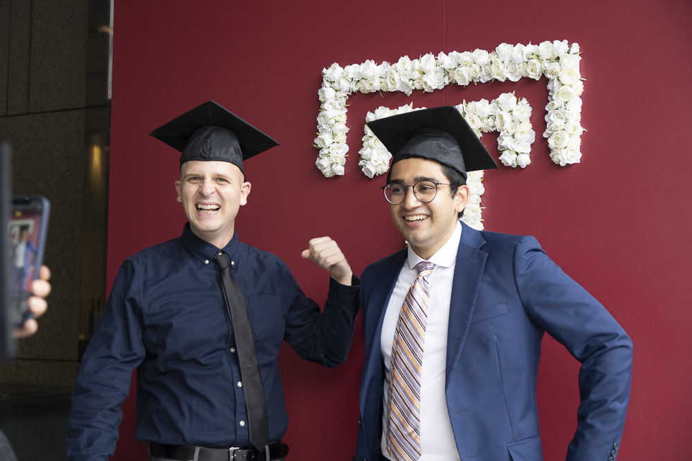 Graduates in front of the Hitomi Hall