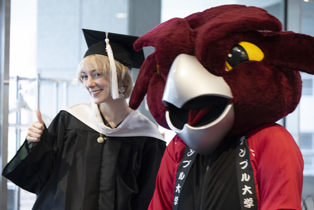 A graduate with Hooter