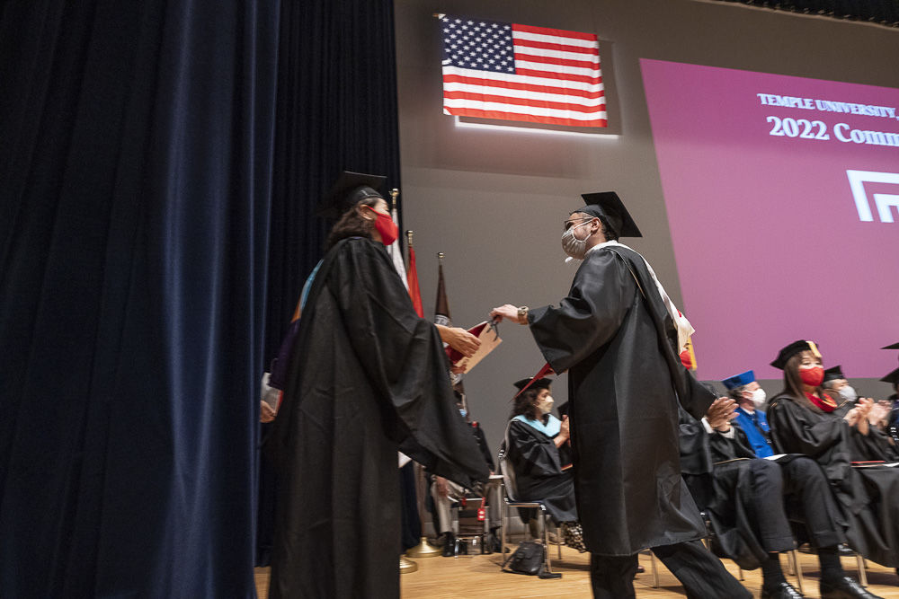 A graduate and Chie Kato, Senior Associate Dean