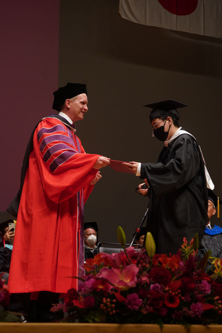 Dean and a Graduate