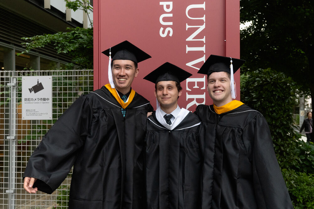 Graduates in front of Temple University, Japan Campus