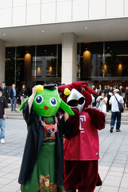 A Graduate with Hooter in front of Hitomi Hall