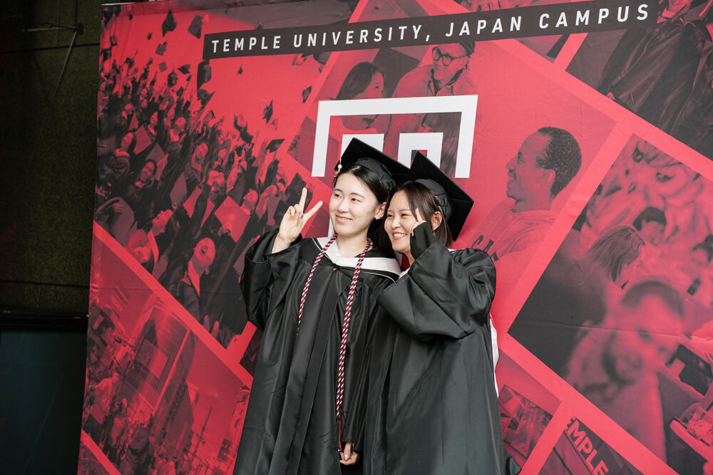 Graduates in front of Hitomi Hall