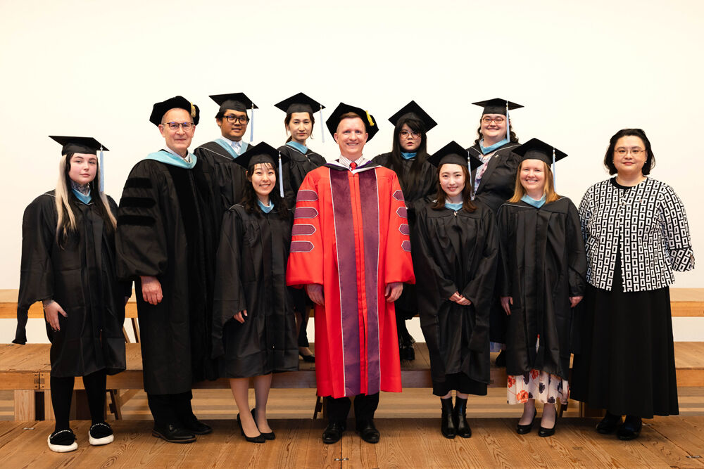 College of Education graduates with the Dean and the Executive Director