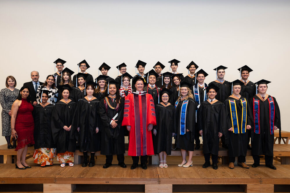 Master in Management graduates with the Dean and the Program Director