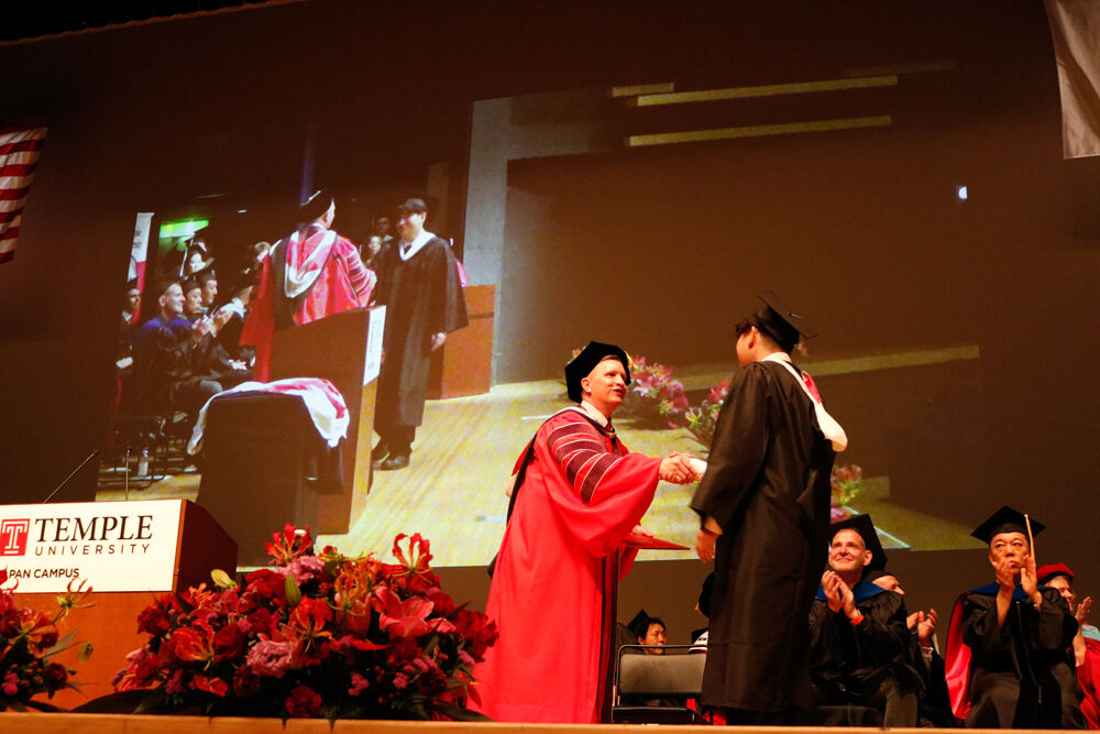Dean and a graduate