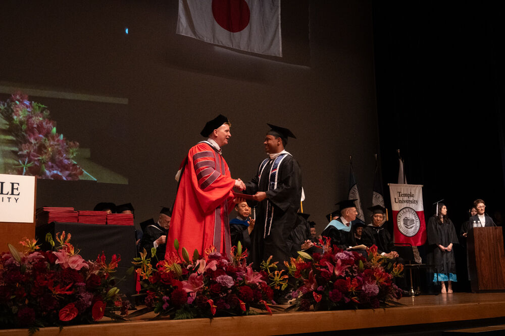 Dean and a graduate