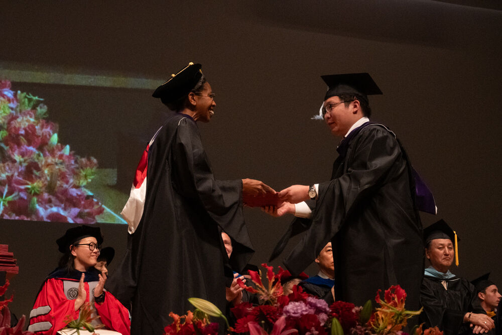 Beasley School of Law Director Saunders and a graduate
