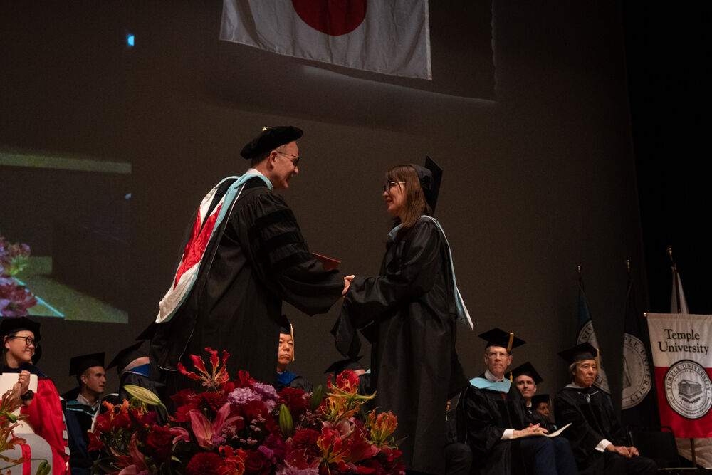David Beglar, Academic Coordinator, with a graduate