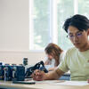 A male student taking a test in the classroom.