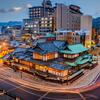 A picture of Dogo Onsen in Matsuyama City at dusk.