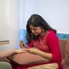A student painting Henna