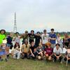 TUJ and Hosei students smile by a freshly planted rice field