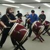 A picture of students playing the taiko drum.