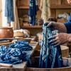 A picture of someone dyeing fabric