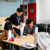 Students and staff members during a class in a TUJ classroom.