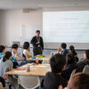 A presenter leading an interactive presentation with students in a classroom.
