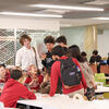 Students studying and chatting in the cafeteria.