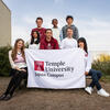 Students' group photo, holding TUJ banner