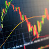 A computer monitor displaying stock price fluctuations