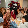 Students smiling and posing for a group selfie with Hooter, the Temple University mascot, during Welcome Week at TUJ.