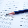 Answer sheets with pencil drawing fill to select choice.