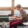 A male Student Taking Notes