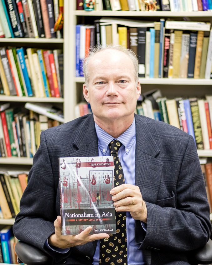 Professor Kingston with one of his latest books “Nationalism in Asia: A History Since 1945”.