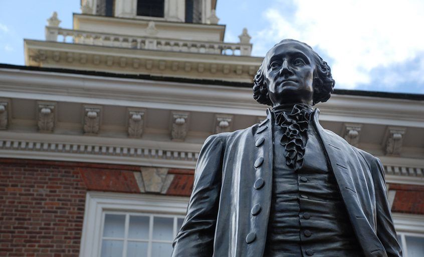 Statue of George Washington in front of the centennial bell at Independence Mall in Philadelphia.