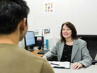 Erica Adams, director of career development giving student consultation.