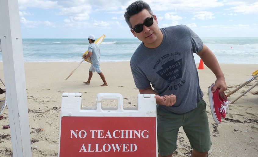 George poses in front of the "NO TEACHING ALLOWED" sign.