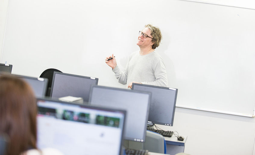 Associate Professor Ronald Carr teaching in a class.