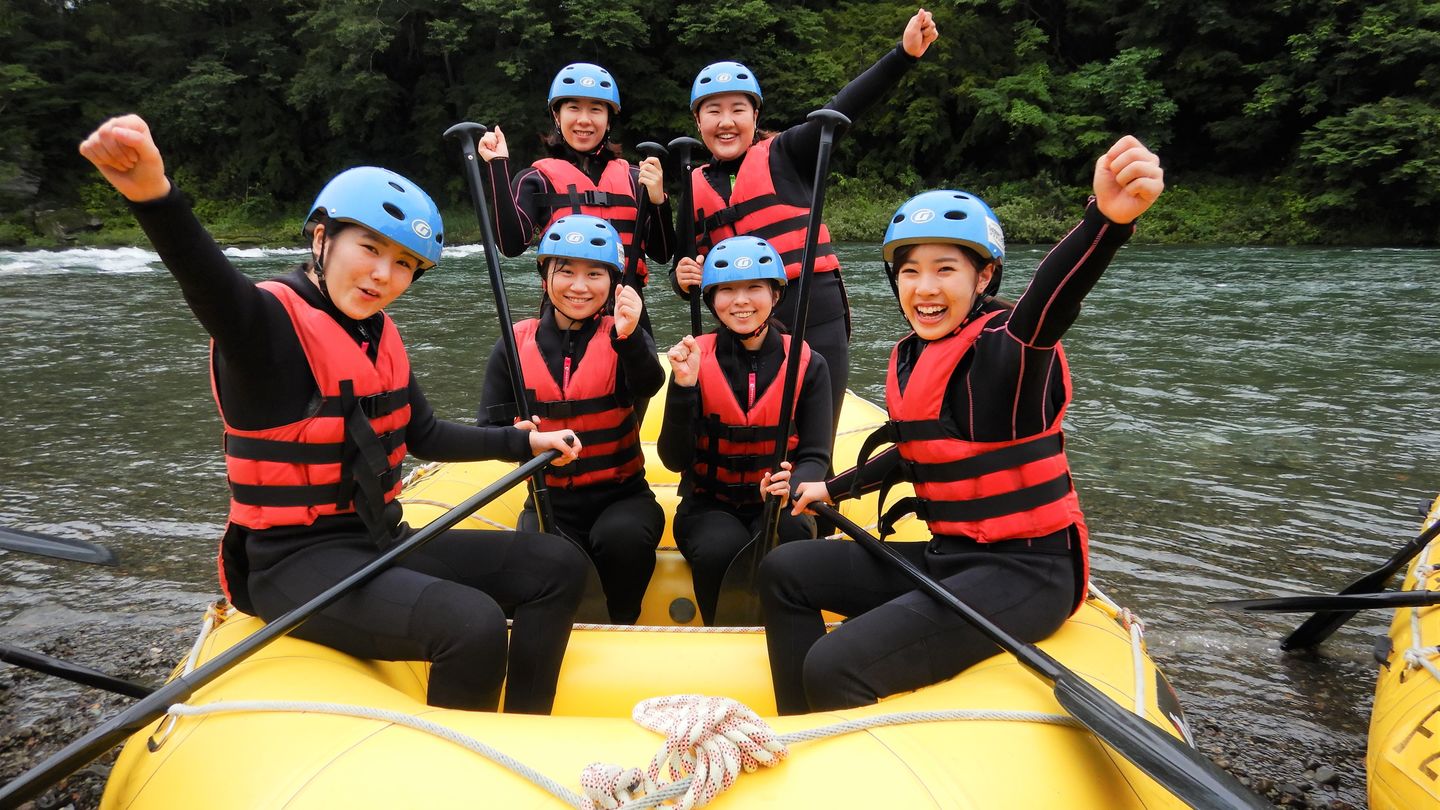 Some students are in a raft boat ready to do river rafting in Nagatoro