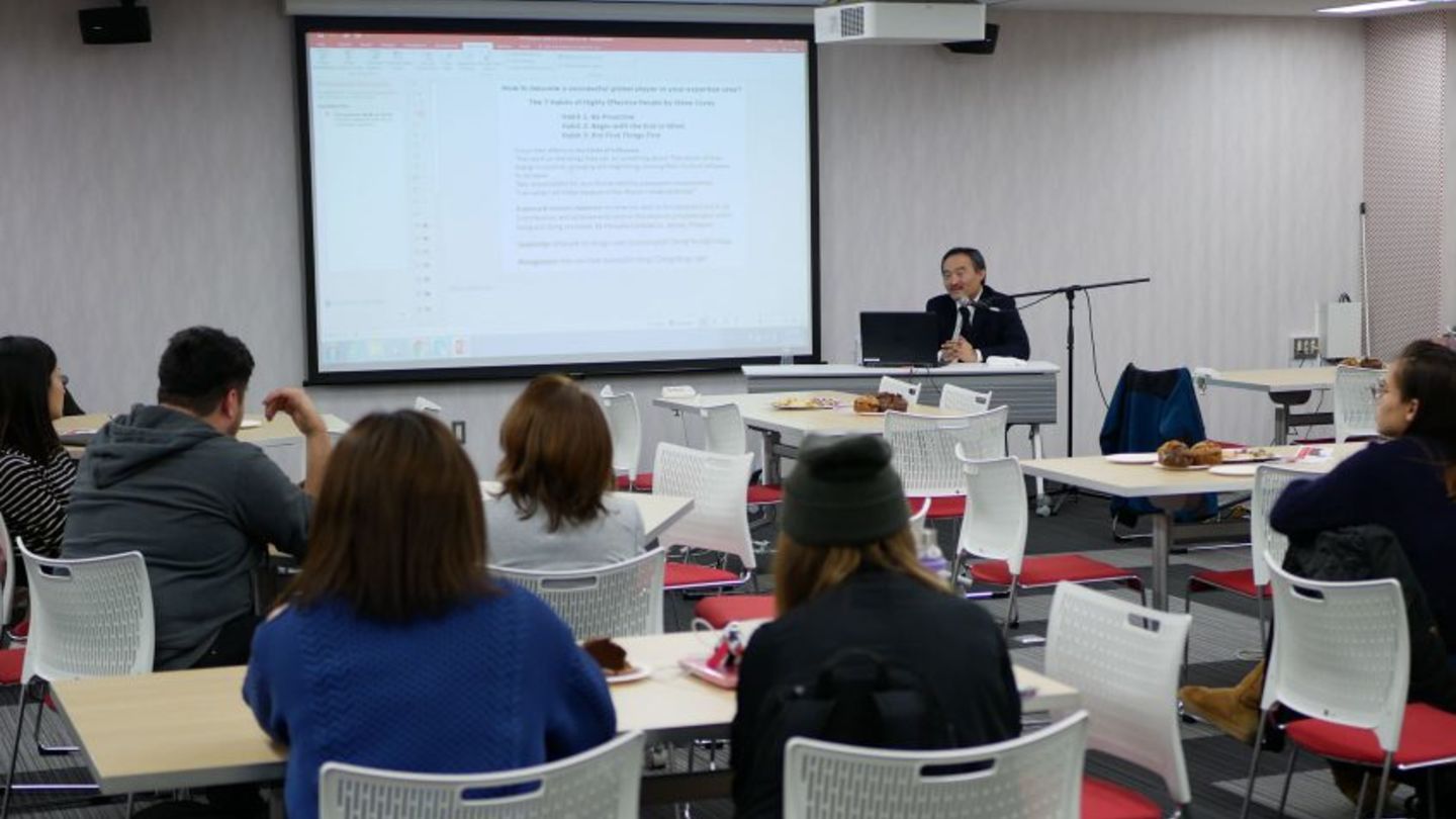 Dr. Yoshiya Toyoda speaking in front of the students.