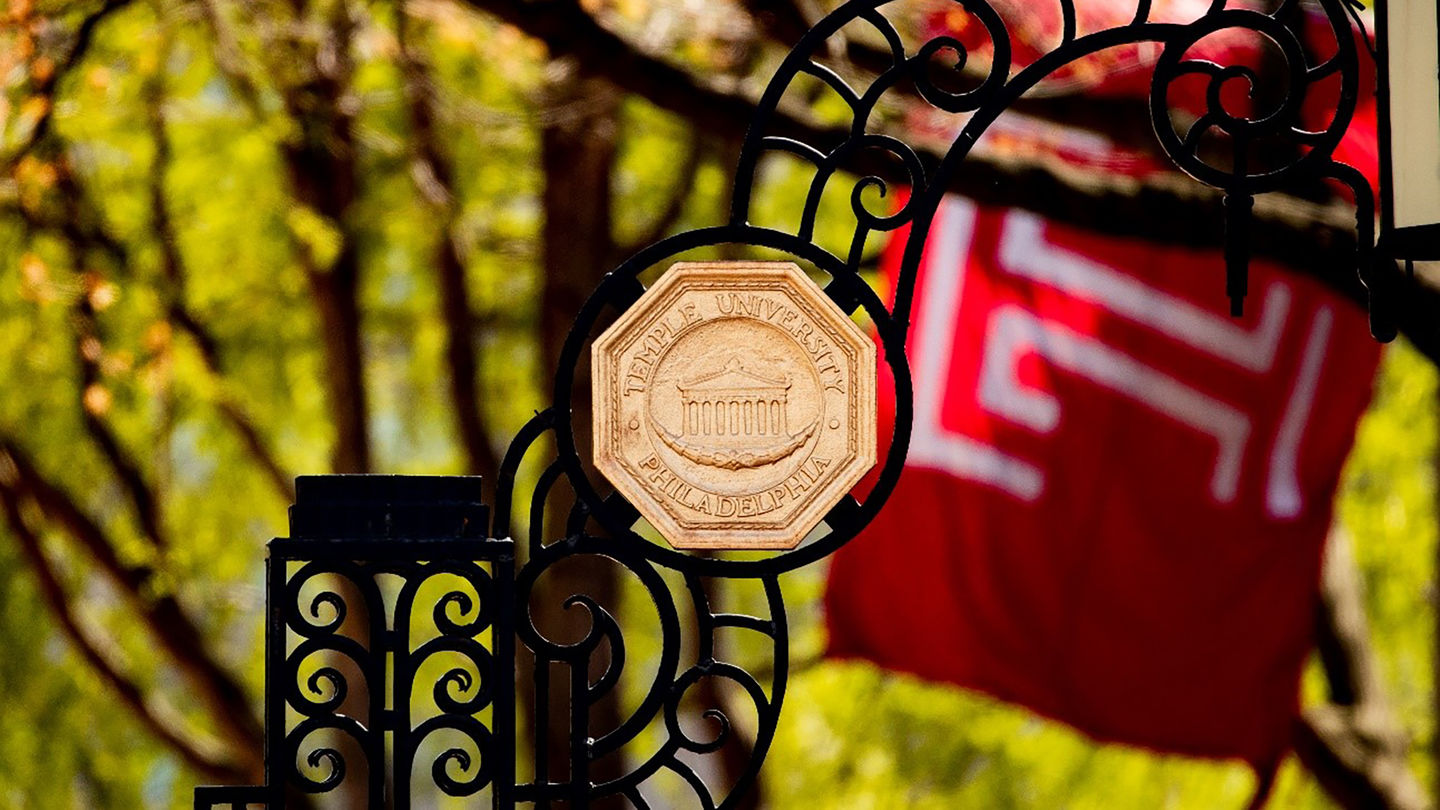 The main gate and the flag of Temple University at Polett Walk in Philadelphia